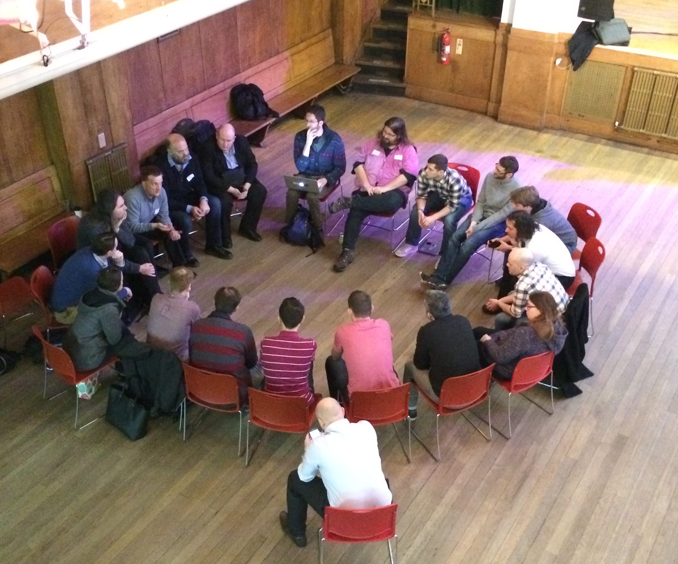 Attendees sitting in a discussion circle