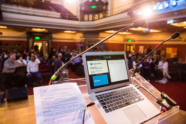 Laptop and notes at a lectern